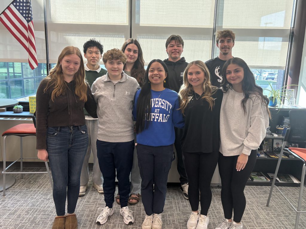 Nine students from the Herkimer CSD top 10 posing together for a photo