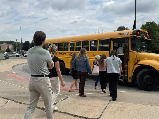 New teachers walking to school bus