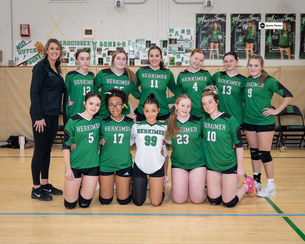Girls athletes posing for a photo together