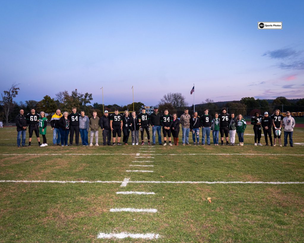 Football seniors and families on field