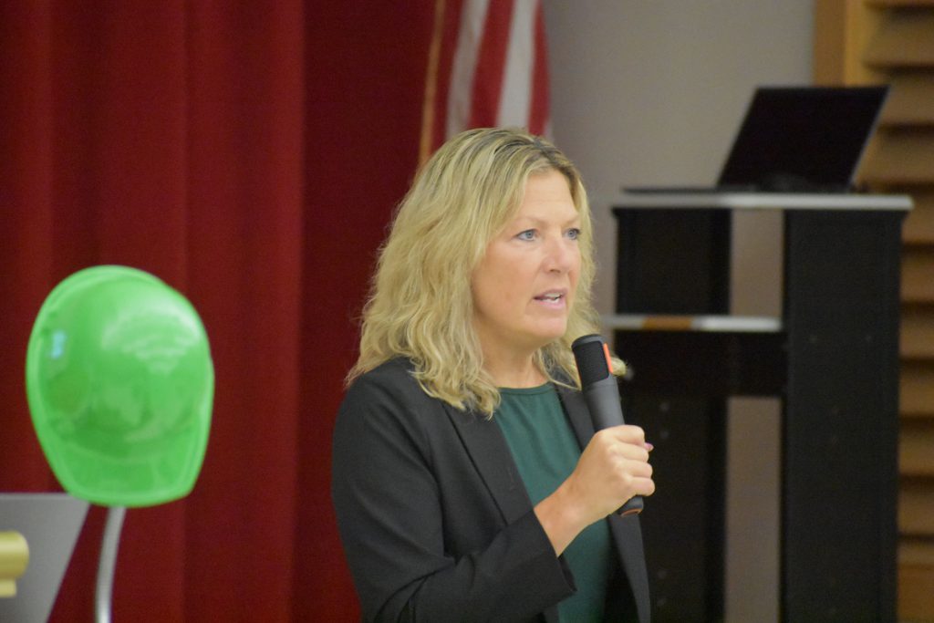 Maria Lindsay speaking into microphone