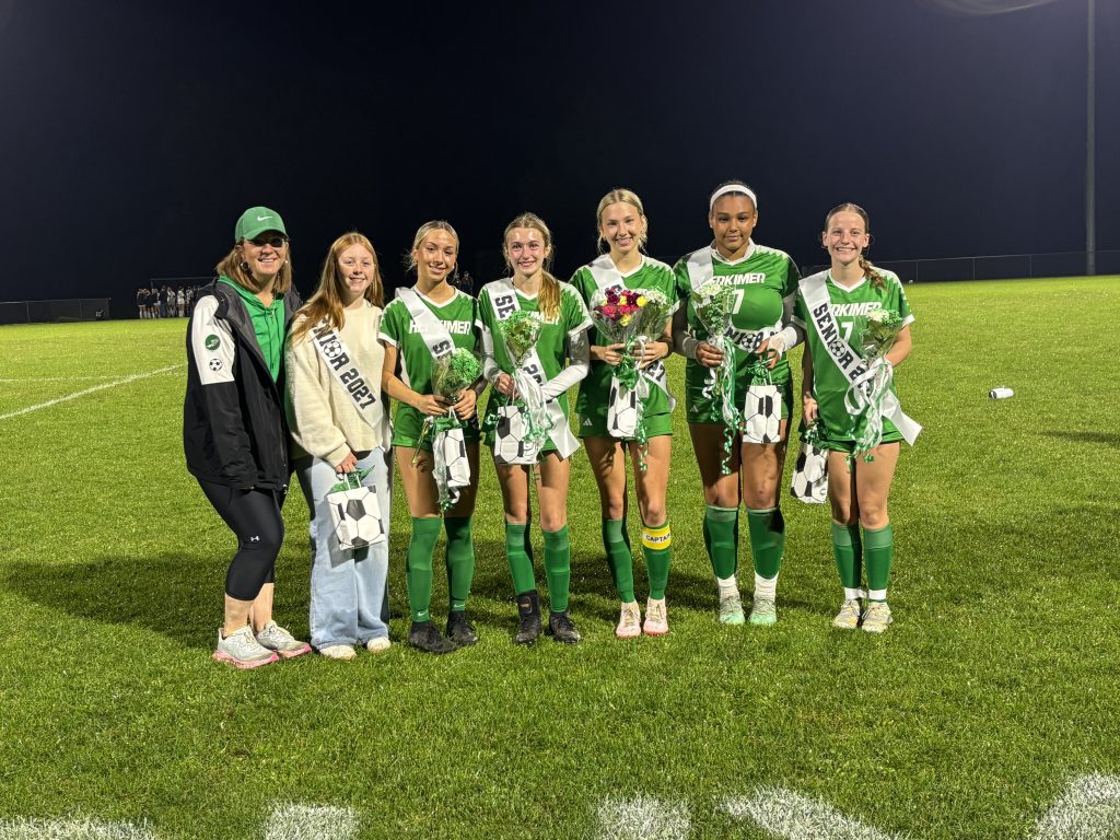 Girls soccer seniors and coaches on senior night