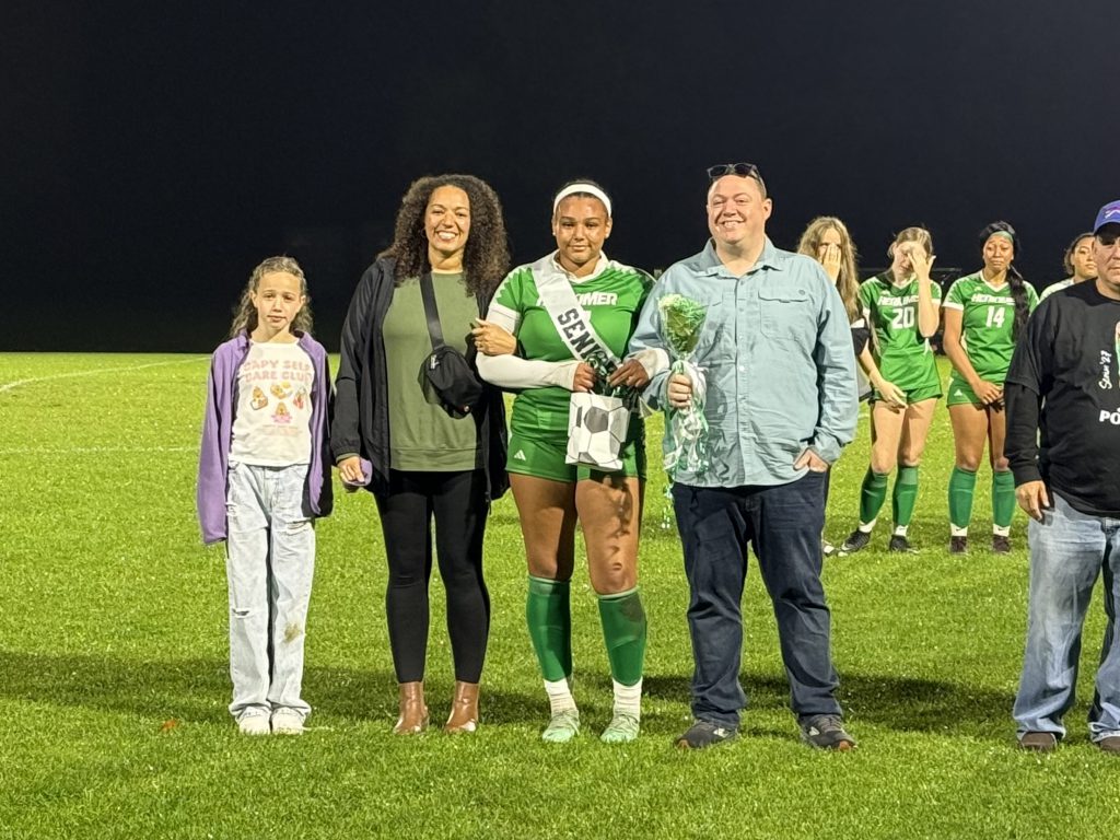 Girls soccer senior with family