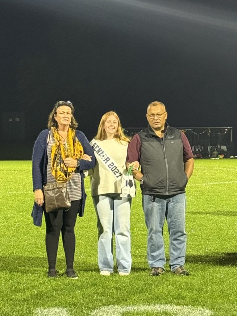 Girls soccer senior with family