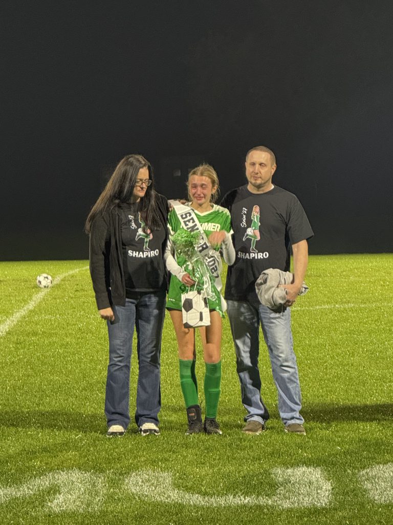 Girls soccer senior with family