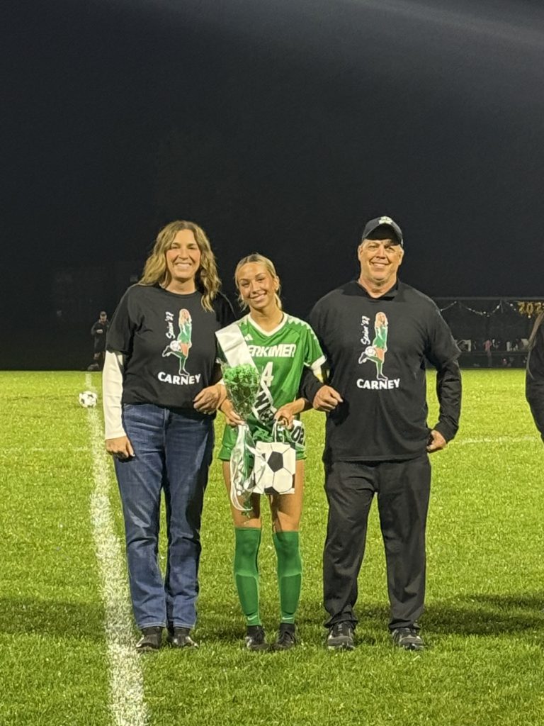 Girls soccer senior with family